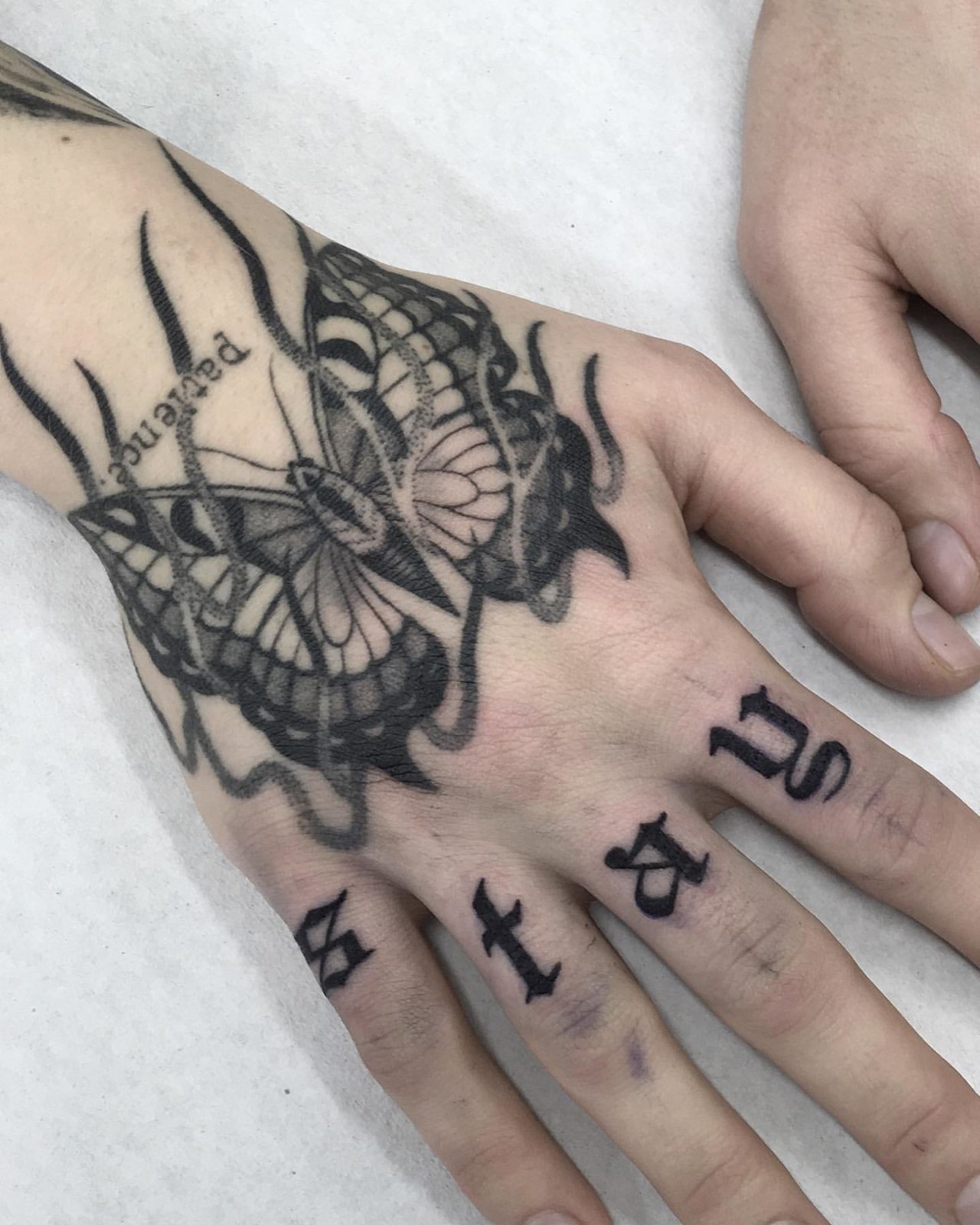 30 Awesome Butterfly Hand Tattoo Ideas for Men & Women in 2024