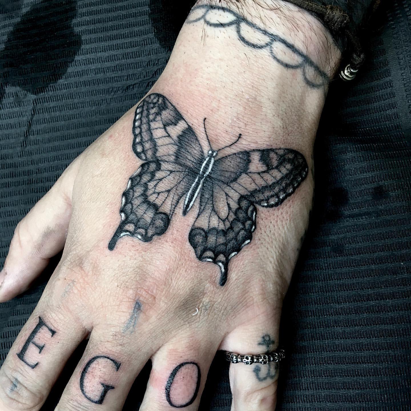 Butterfly hand tattoos for men