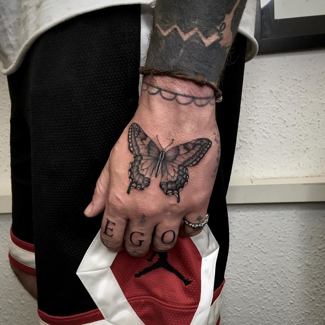 30 Awesome Butterfly Hand Tattoo Ideas for Men & Women in 2024