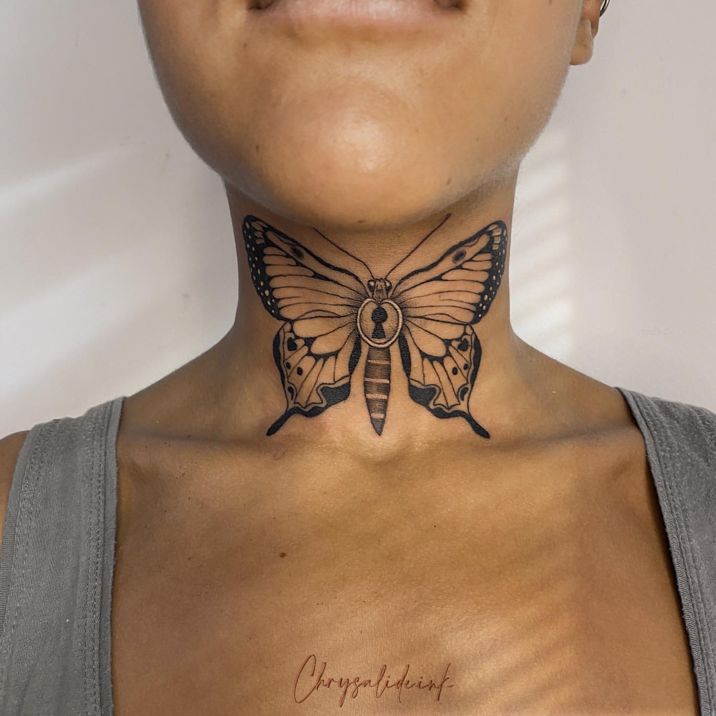 Mandala and lotus tattoo on the neck - Tattoogrid.net