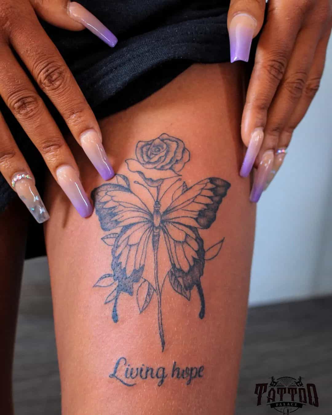 
Butterfly and roses tattoo thigh on black skin