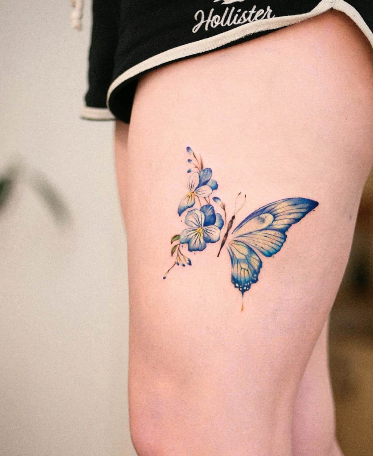 Beautiful butterfly thigh tattoo