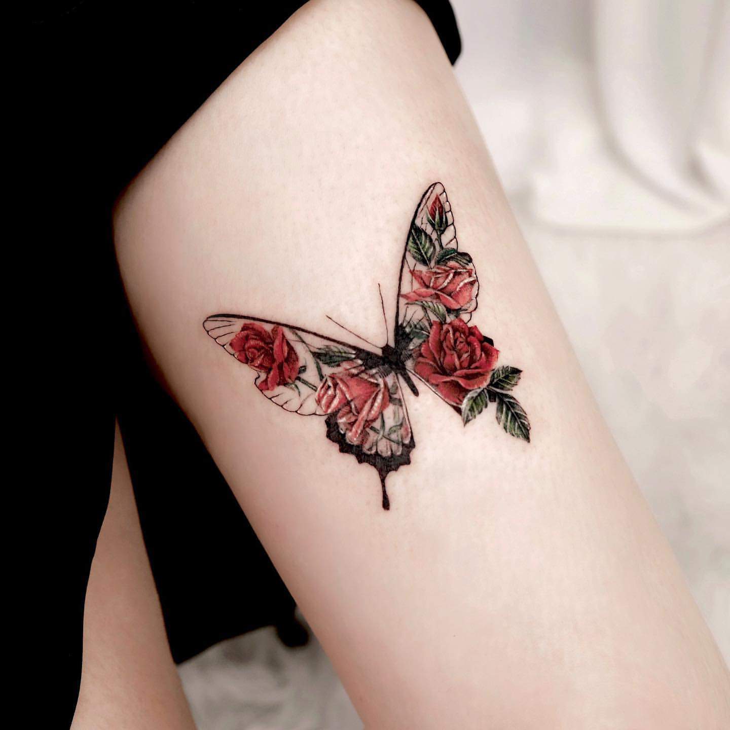 Butterfly thigh tattoos for females