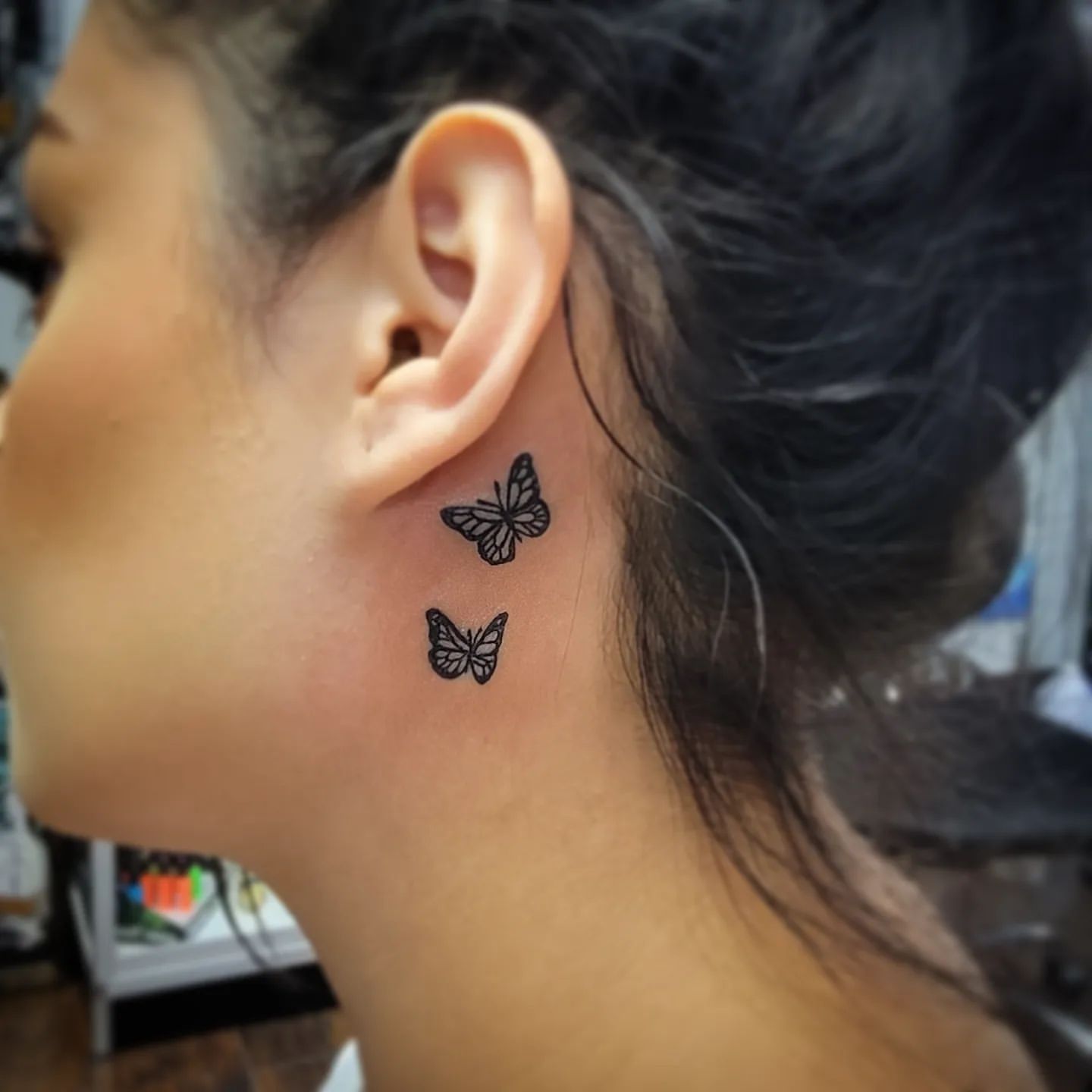 Butterfly tattoo designs behind ear