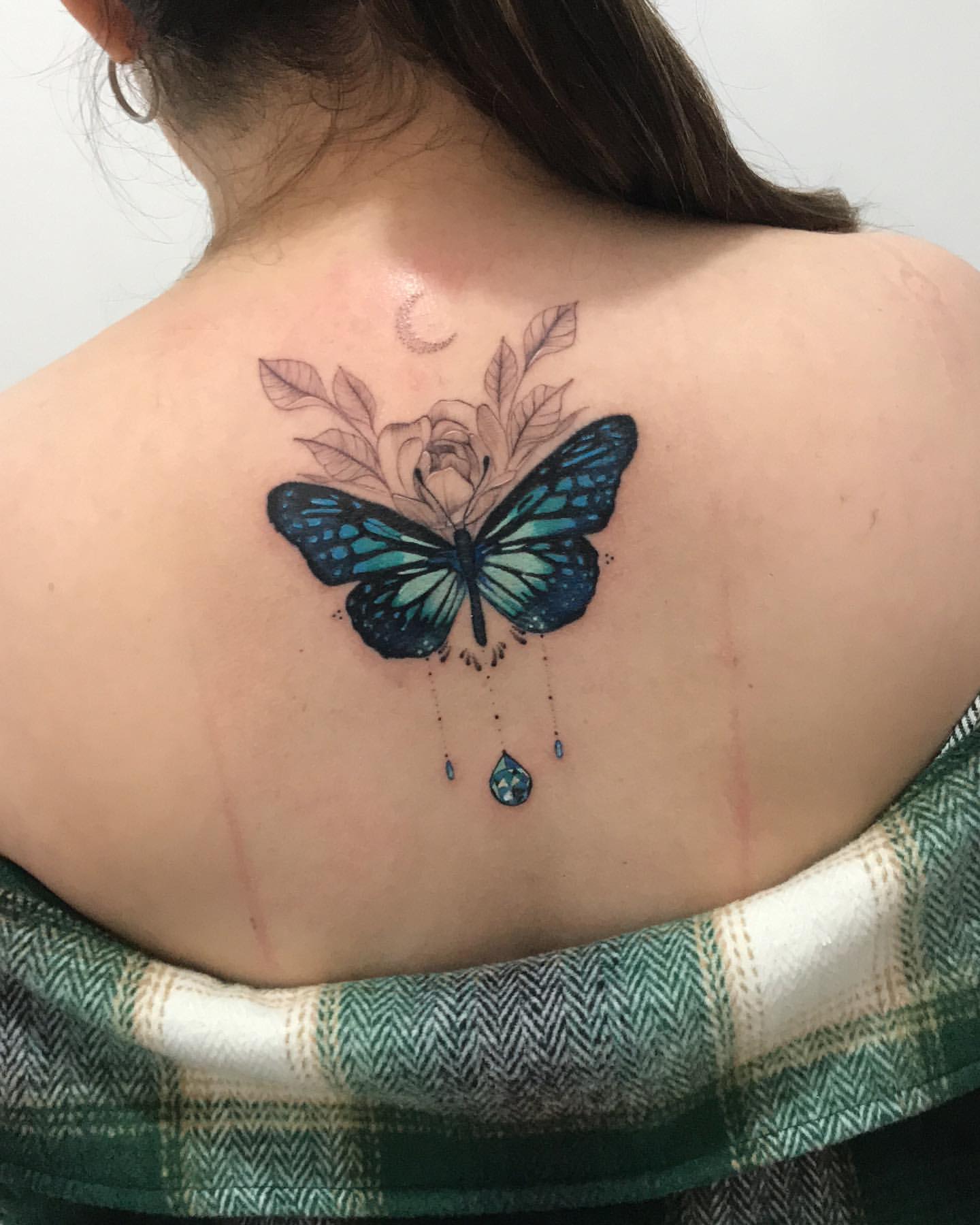 Blue and green butterfly tattoo
