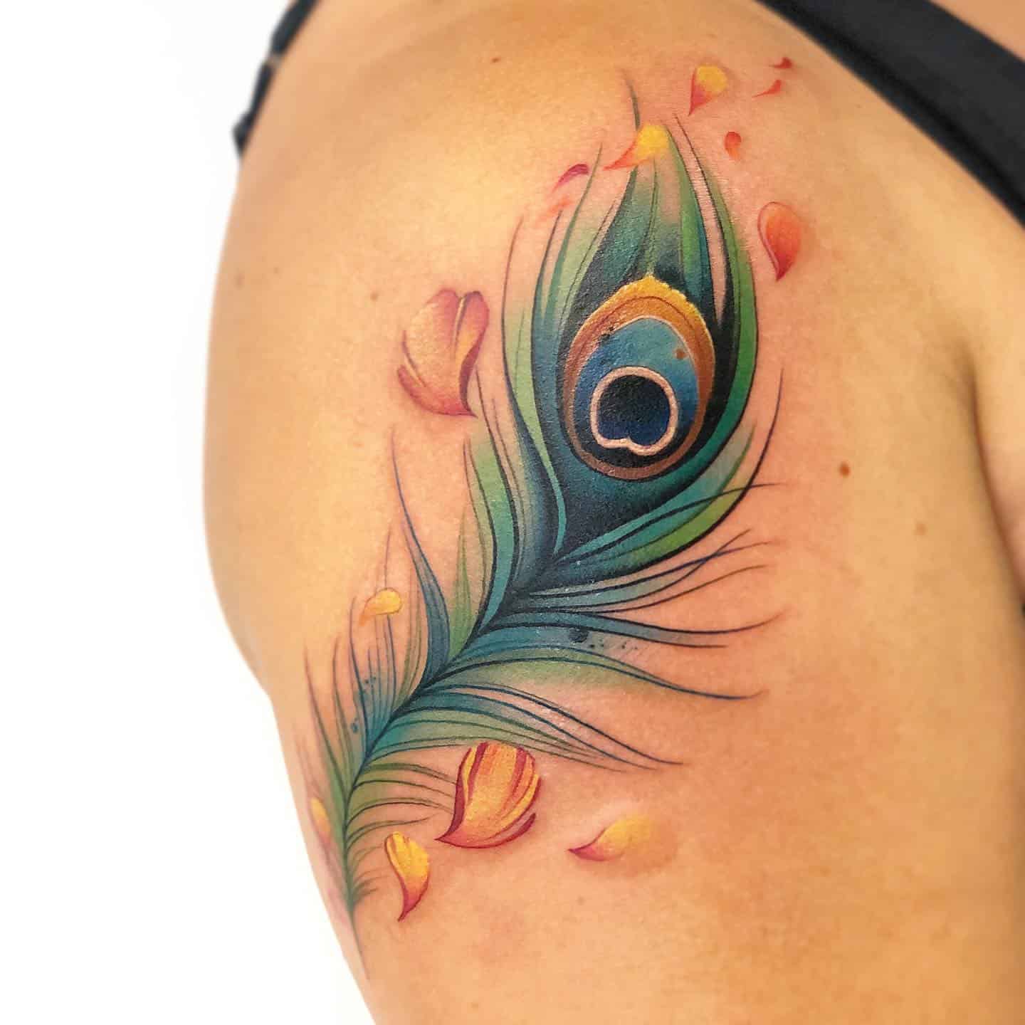 Pretty peacock feather tattoo by Magdalena  Feather tattoo design Peacock  feather tattoo Feather tattoos