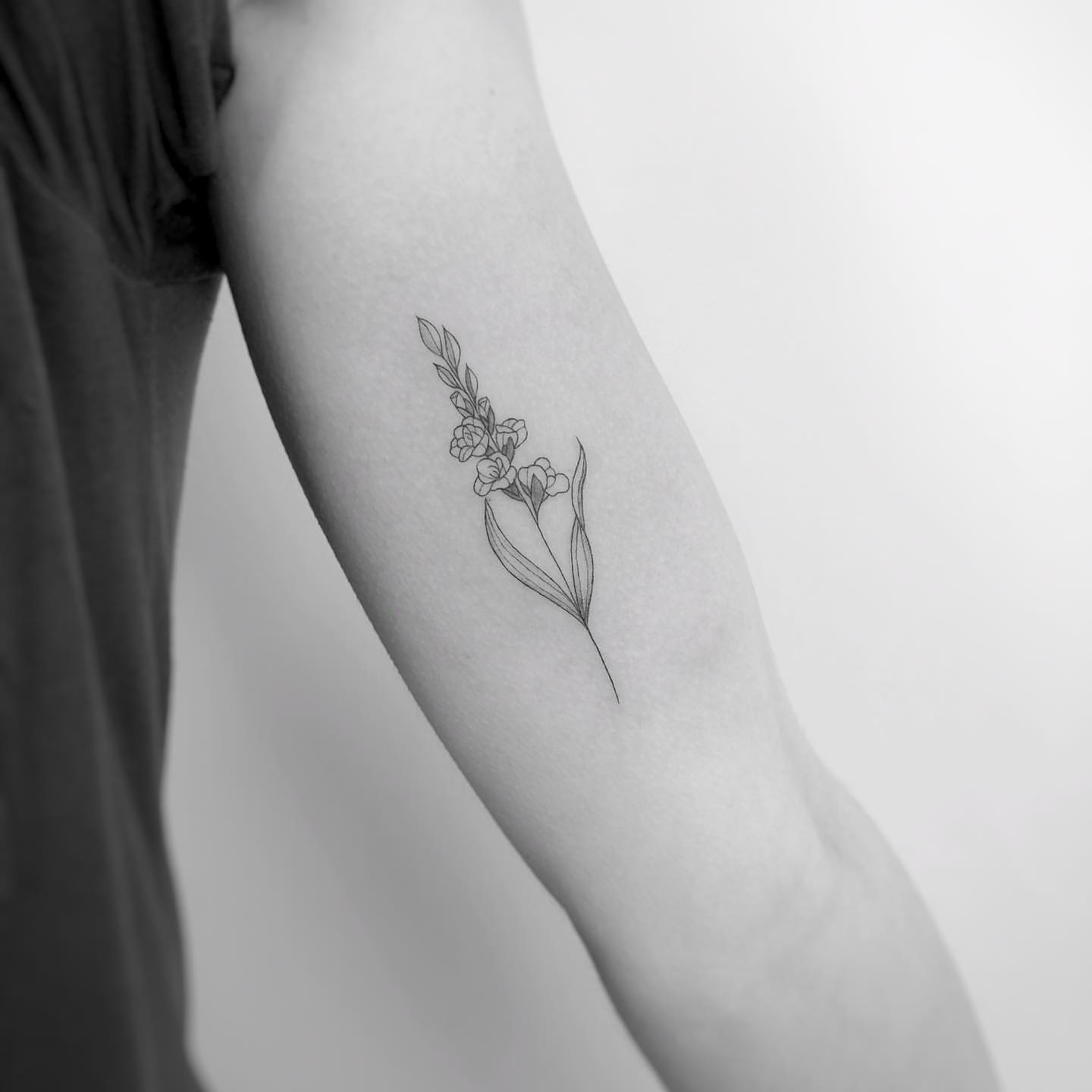 Simple gladiolus flower tattoo
