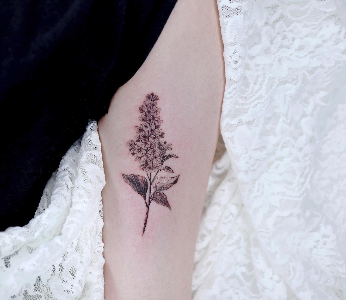 Minimalist lilac tattoo