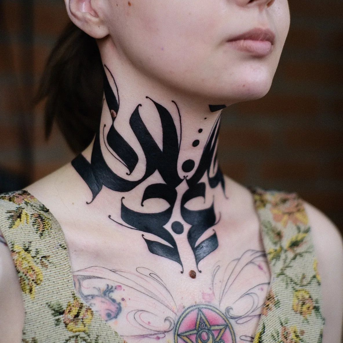 Throat Tattoo Ideas for Women 11