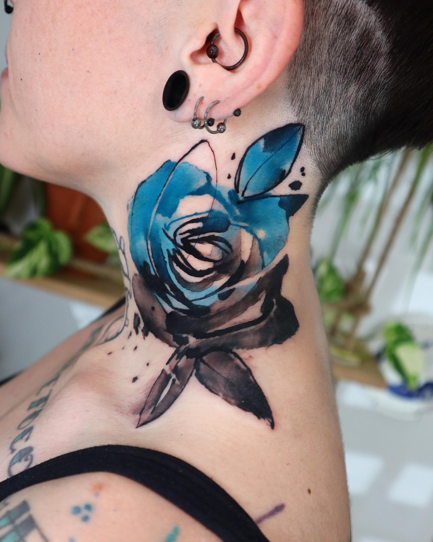 Throat Tattoo Ideas for Women 14