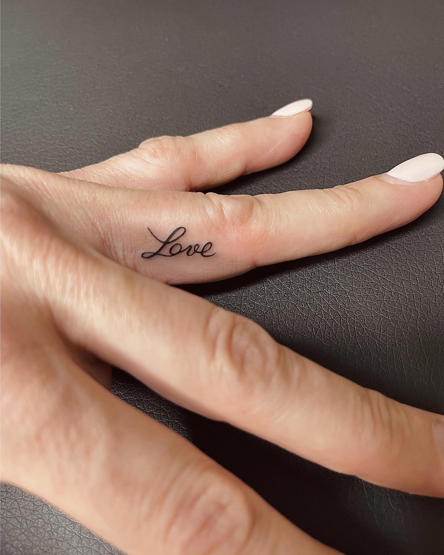 Ring Finger Tattoo Ideas 30