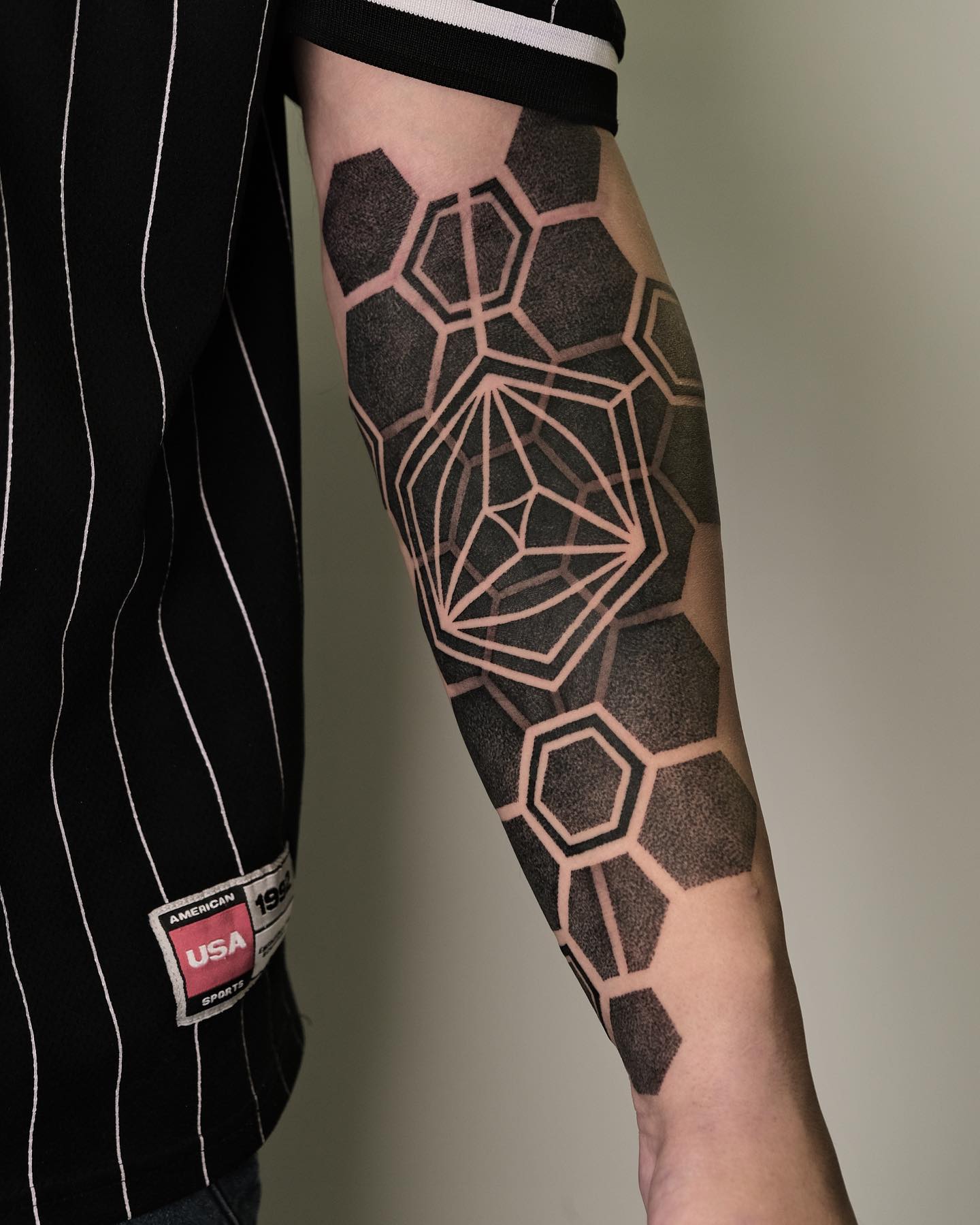 Dotwork geometric tattoo sleeve.