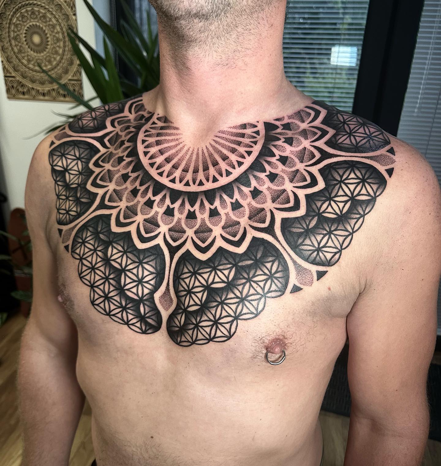 Black pattern chest tattoo - Tattoogrid.net