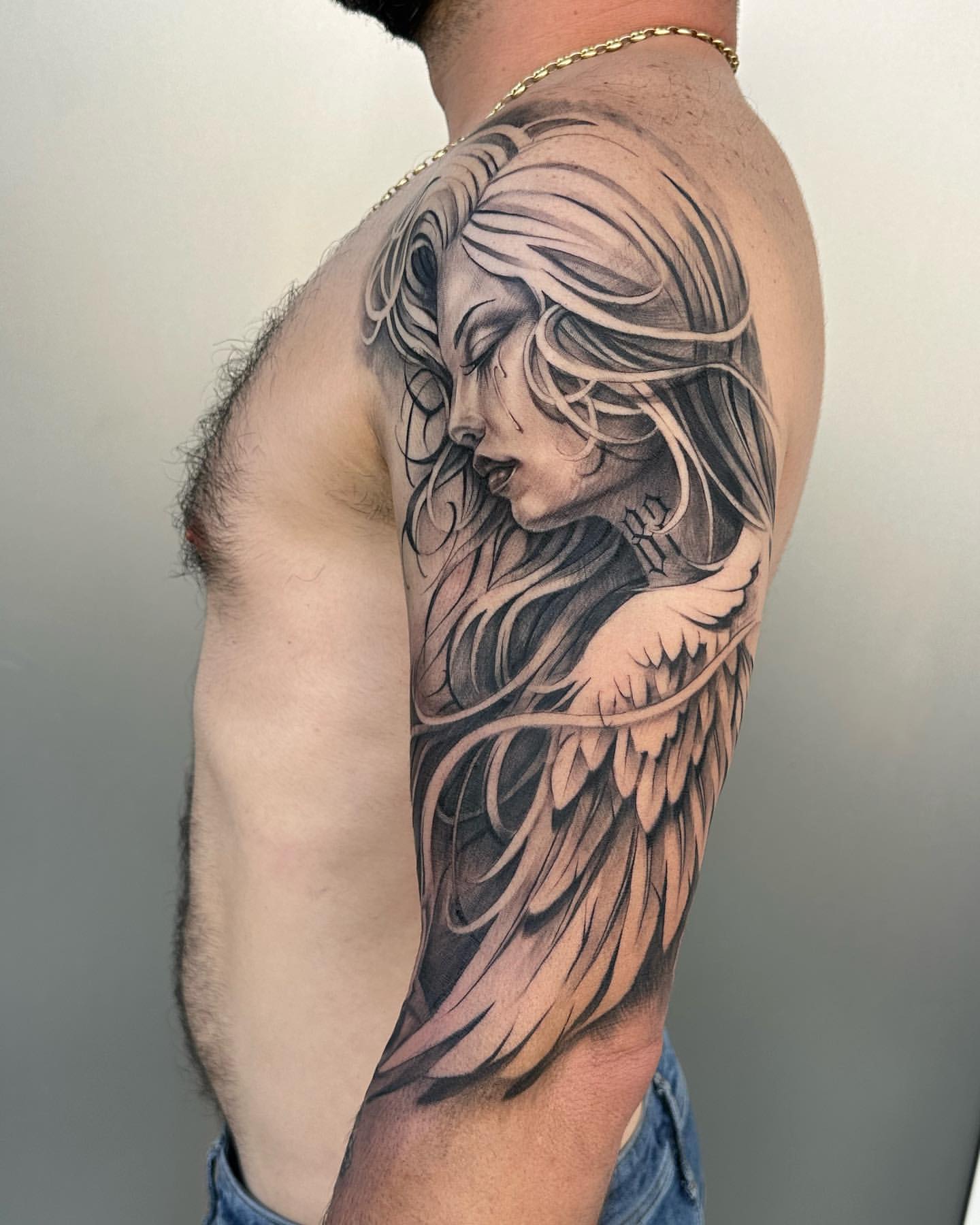 Angel tattoos for men and women and the meaning of the divine symbol
