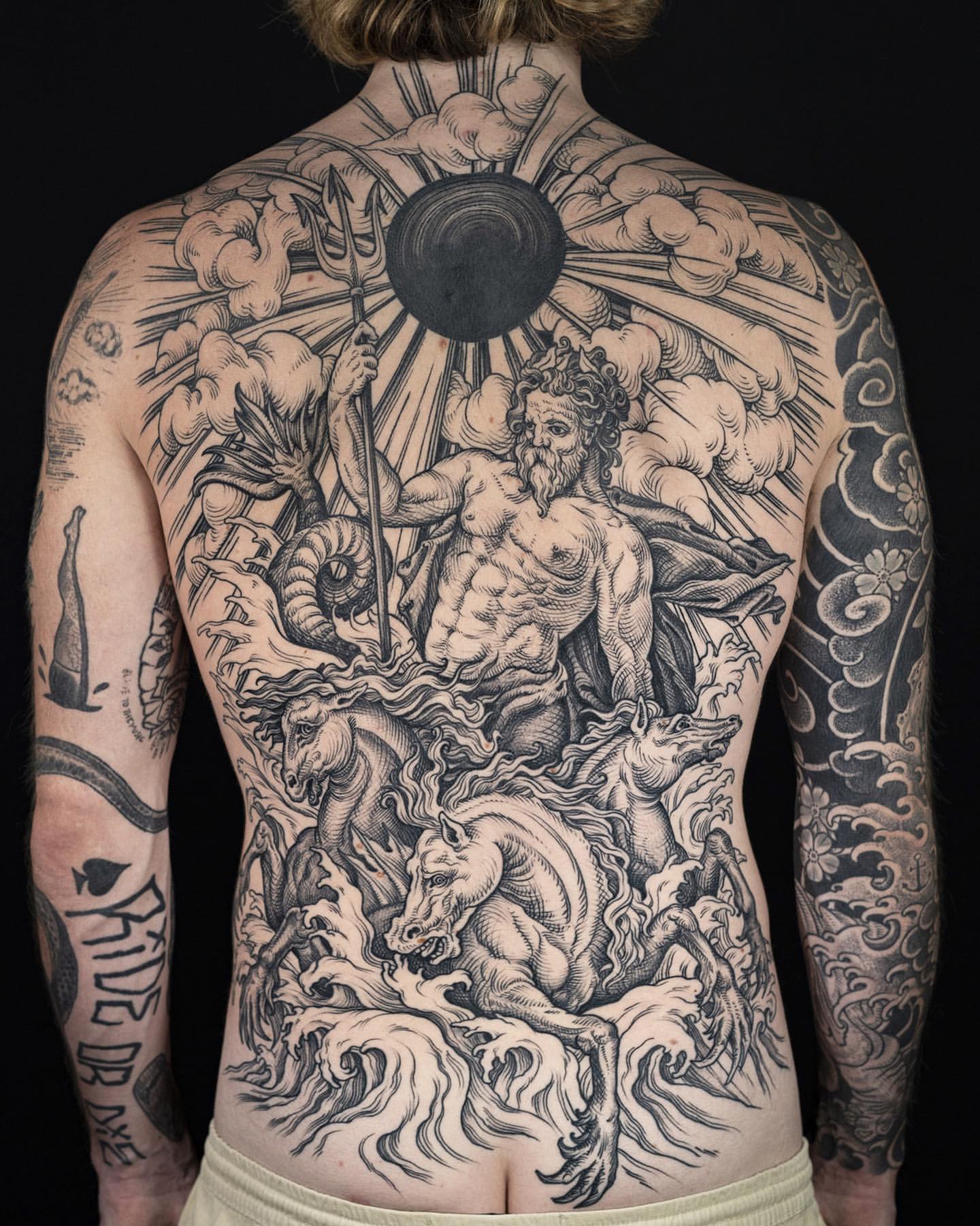 Black and grey Poseidon backpiece tattoo.